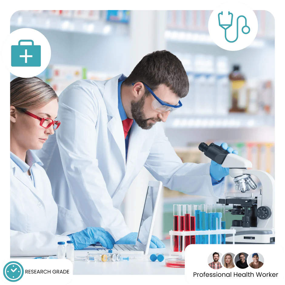 Two scientists in a lab setting with a microscope and laptop.